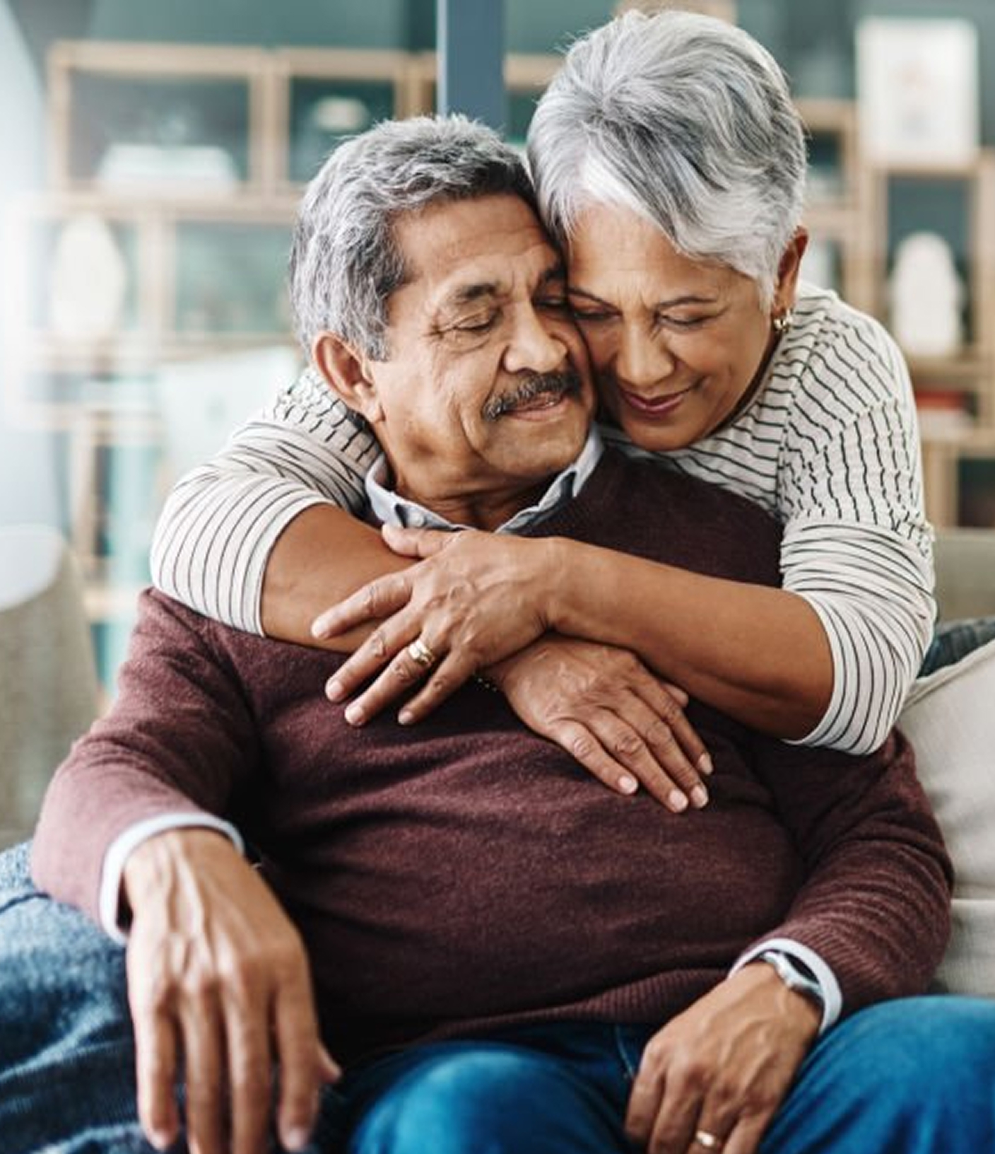 An older couple embraces